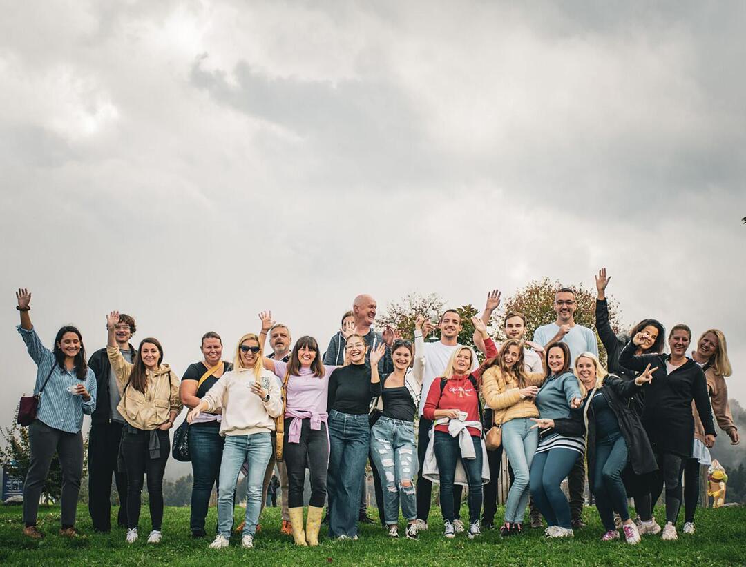BE-terna team smiling outdoors during company outing, highlighting positive work culture and strong employee connections.