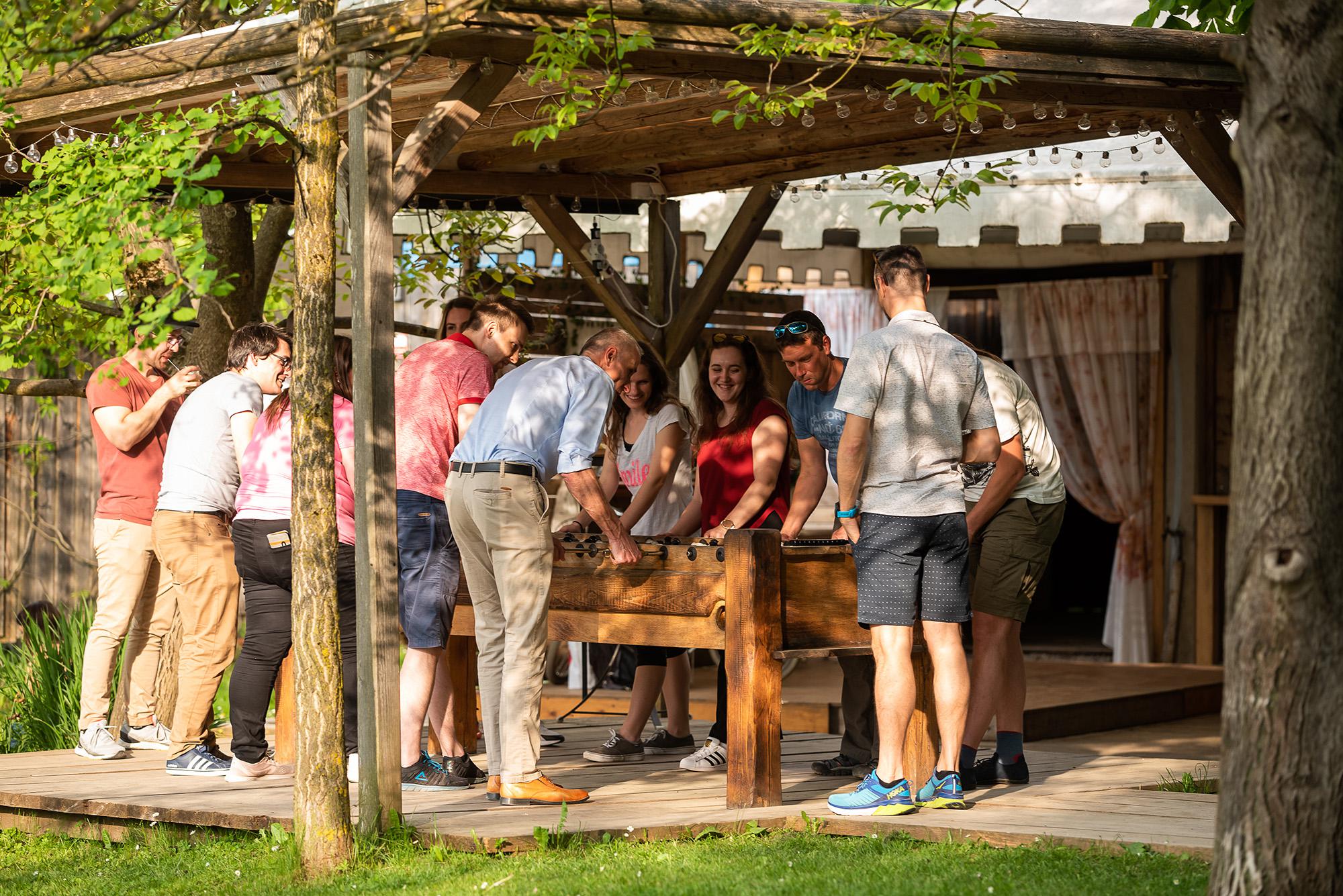 BE-terna employees together outdoors during team event, promoting fun company culture and informal team bonding.