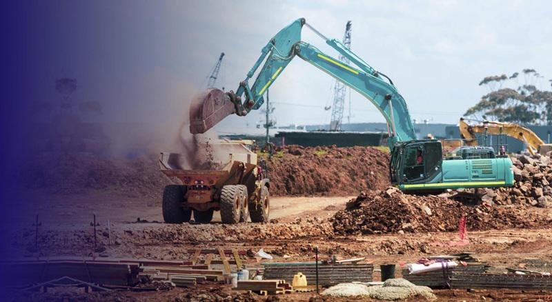 ERP-based fleet and rental management – excavator loading dump truck at a construction site